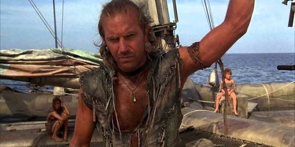 Kevin Costner leaning on a boat in Waterworld