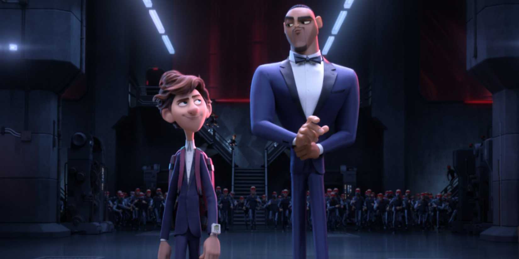 A boy walking next to a man in a tux in Spies in Disguise