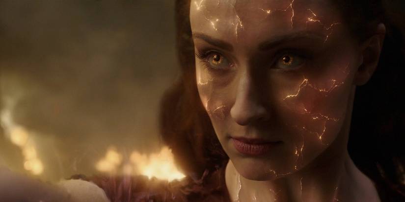 Jean Grey with fire cracks on her face in the movie Dark Phoenix.