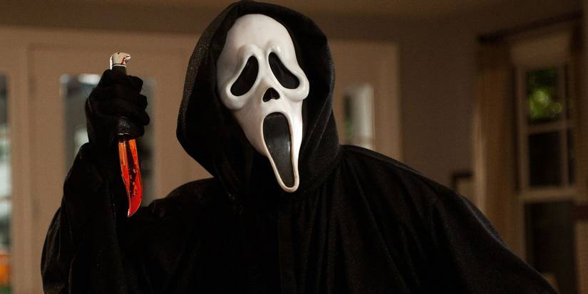 Ghostface raising a bloody knife in Scream.