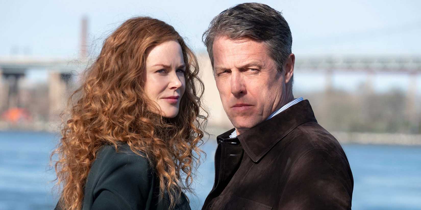 Seorang pria dan wanita berdiri di tepi air di The Undoing.