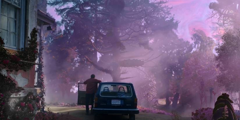 A man stands by his car as a mysterious purple glow glistens over his property in Color Out of Space.