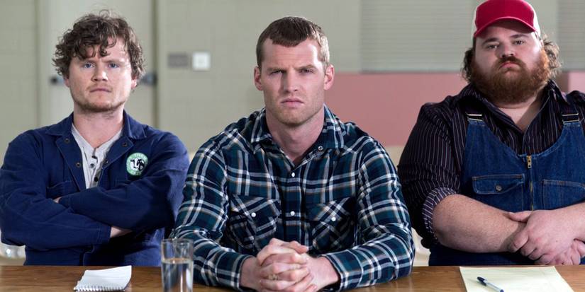 The cast of Letterkenny sitting in a table and looking straight to the camera.