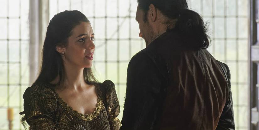 Adelaide Kane as Mary talking to a man and looking up in concern in Reign