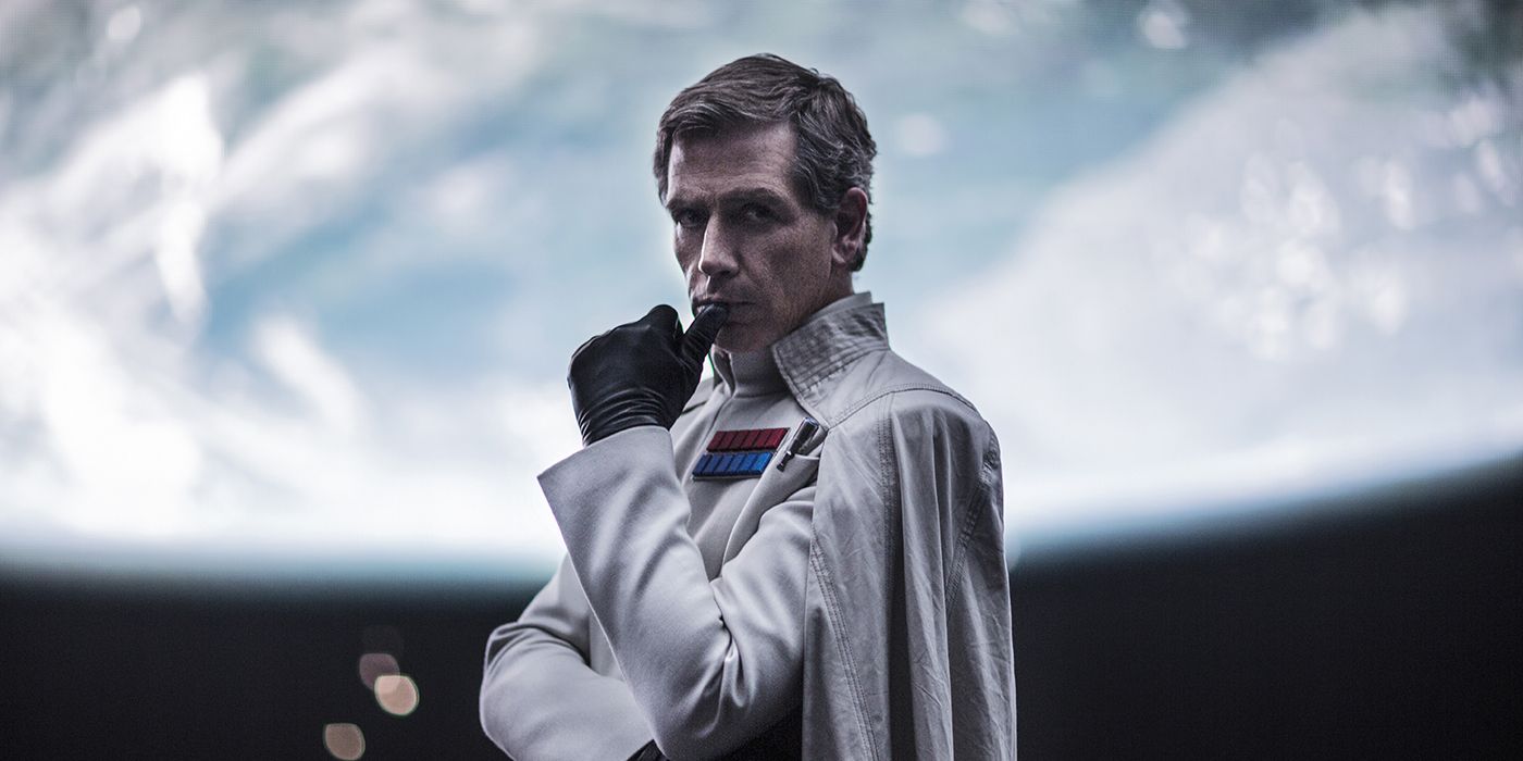 Ben Mendelsohn stands onboard a starship with a planet in view behind in Rogue One: A Star Wars Story.