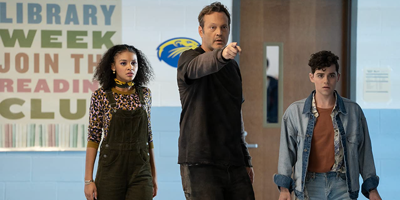 Vince Vaughn standing in a school hallway with Misha Osherovich and Celeste O'Connor in Freaky (2020)