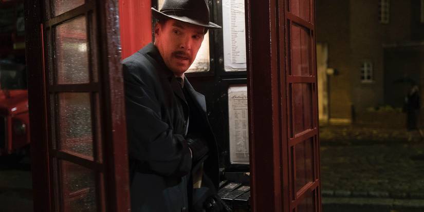 Benedict Cumberbatch as Greville Wynne standing inside a phone booth in The Courier