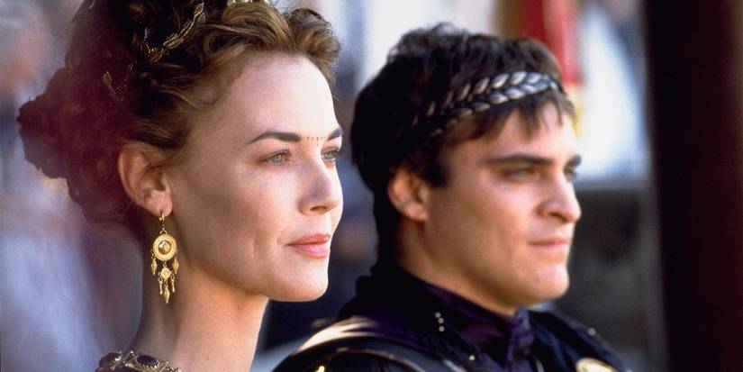 Lucilla and Commodus looking ahead while smiling in Gladiator