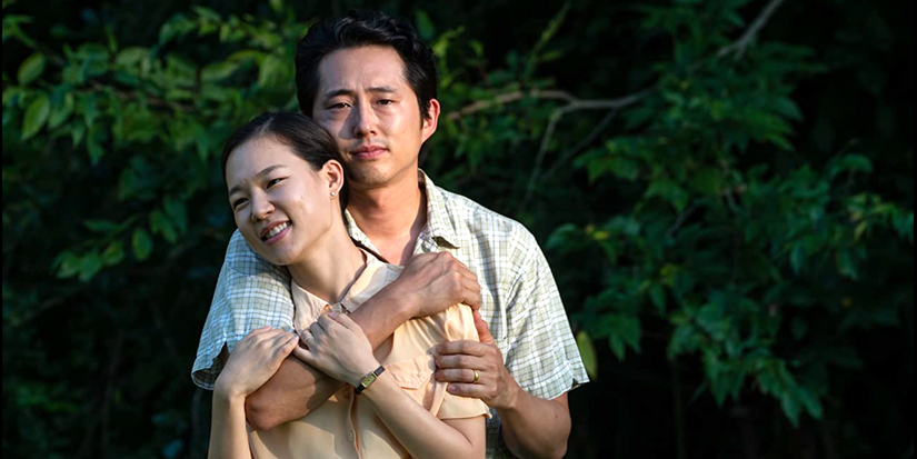 Steven Yeun hugging Han Ye-ri in Minari.