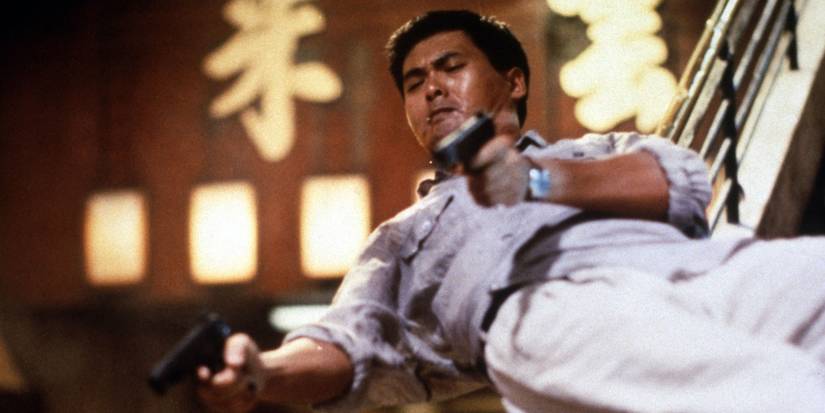 Chow Yun-fat aiming two guns in Hard Boiled.