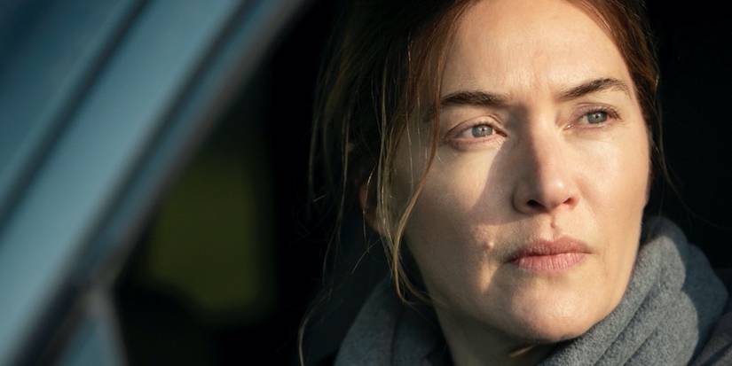 Kate Winslet looking out a car window in 'Mare of Easttown'