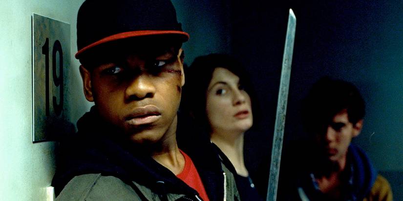 John Boyega and his friends hide behind a wall in Attack the Block