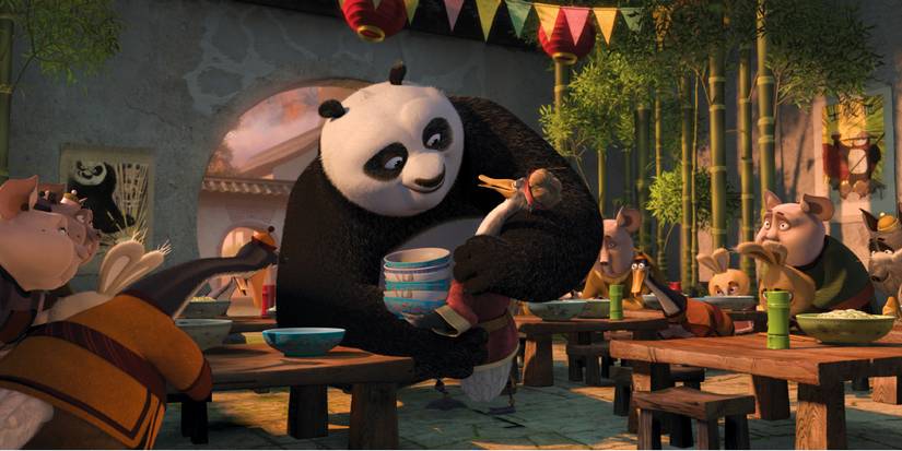Po the panda, voiced by Jack Black, talks to his adopted dad Mr. Ping, voiced by James Hong in Kung Fu Panda 2