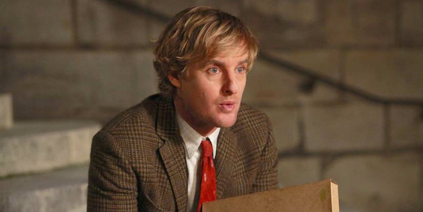 Gil looking confused while looking at someone off-camera in Midnight in Paris