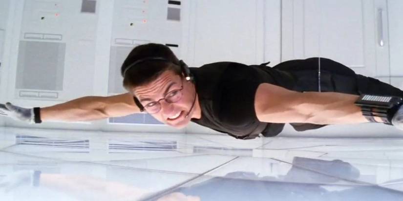 Ethan Hunt hanging while nearly touching the floor in Mission: Impossible