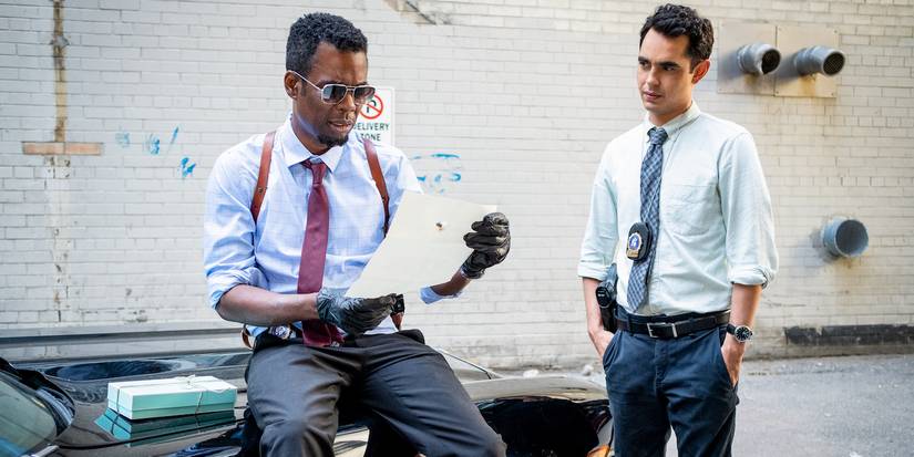 Chris Rock and Max Minghella go over the case in Spiral.