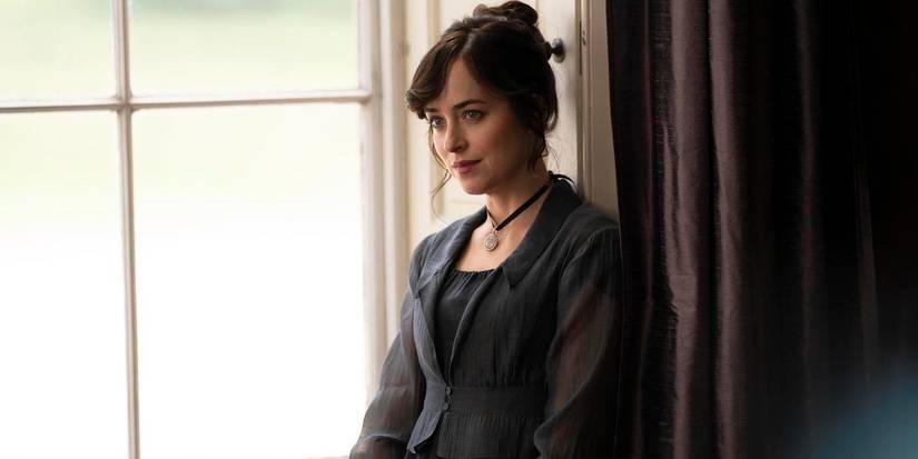 Anne Elliot smiling softly while next to a window in Persuasion