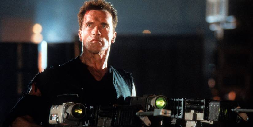 arnold schwarzenegger dressed in black holding guns in eraser