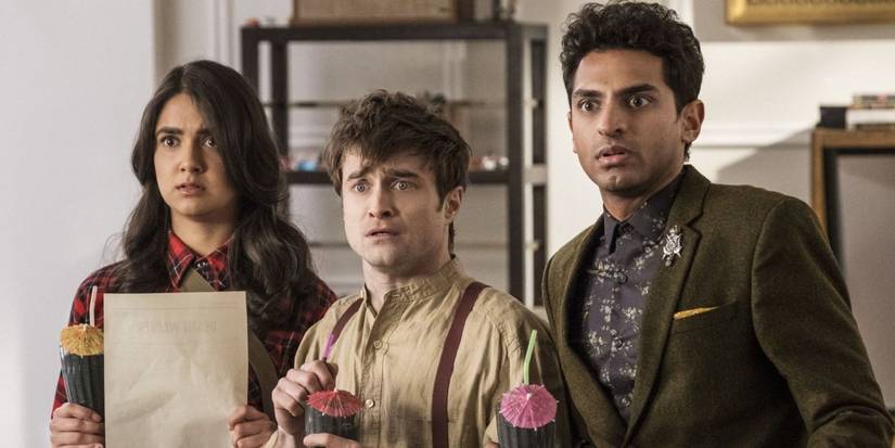 Geraldine Viswanathan, Daniel Radcliffe and Karan Soni looking shocked in Miracle Workers.