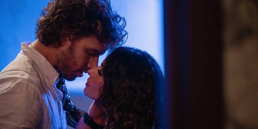 Two characters holding each other close, seemingly about to kiss in a still of the series Sex/Life on Netflix.