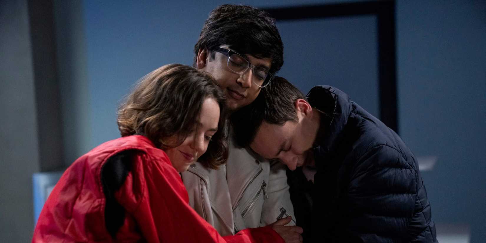 Three people embracing and smiling with eyes closed in Netflix's Aptypical.