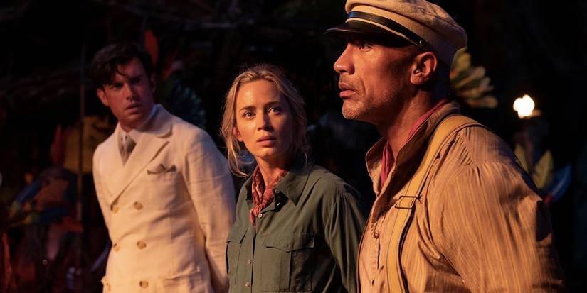 Jack Whitehall, Emily Blunt, and Dwayne Johnson with their hands tied behind their backs in Jungle Cruise.