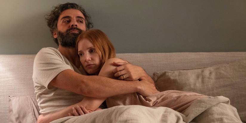 Oscar Isaac and Jessica Chastain embracing in bed in 'Scenes from a Marriage'