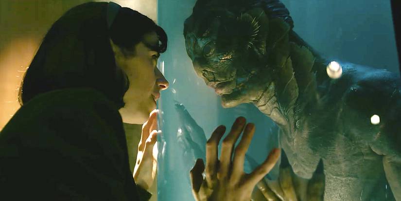 Elisa presses against the tank where the Amphibian Man is in The Shape of Water.
