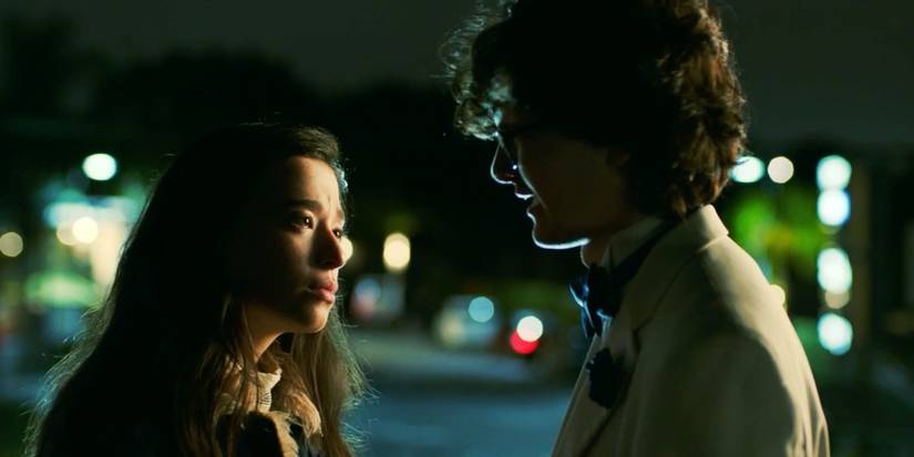 A young boy and girl looking at each other in It Takes Three