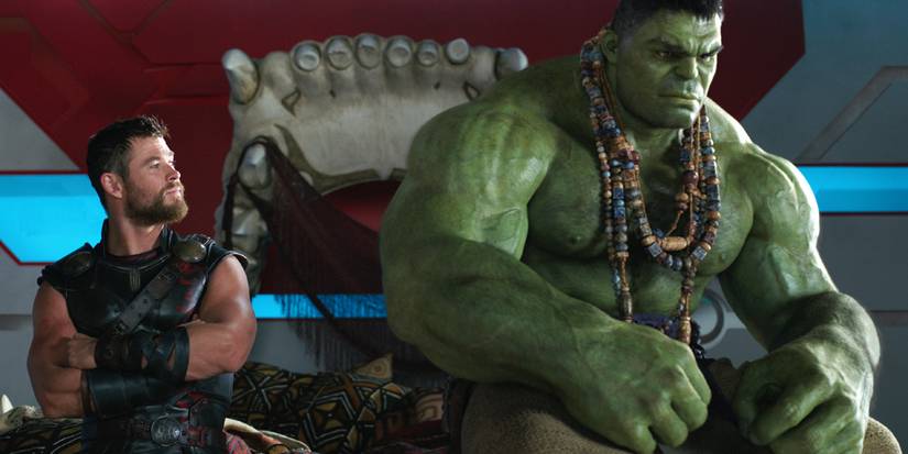 Mark Ruffalo as Hulk pouting next to Chris Hemsworth's Thor in Thor: Ragnarok