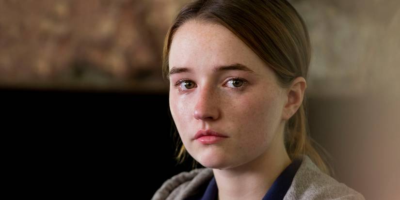 Marie Adler crying while looking at the camera in Unbelievable.