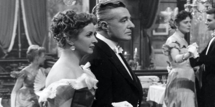 Two people together at a party in The Earrings of Madame de…  