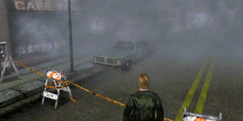 A man in front of a blocked street full of mist in Silent Hill