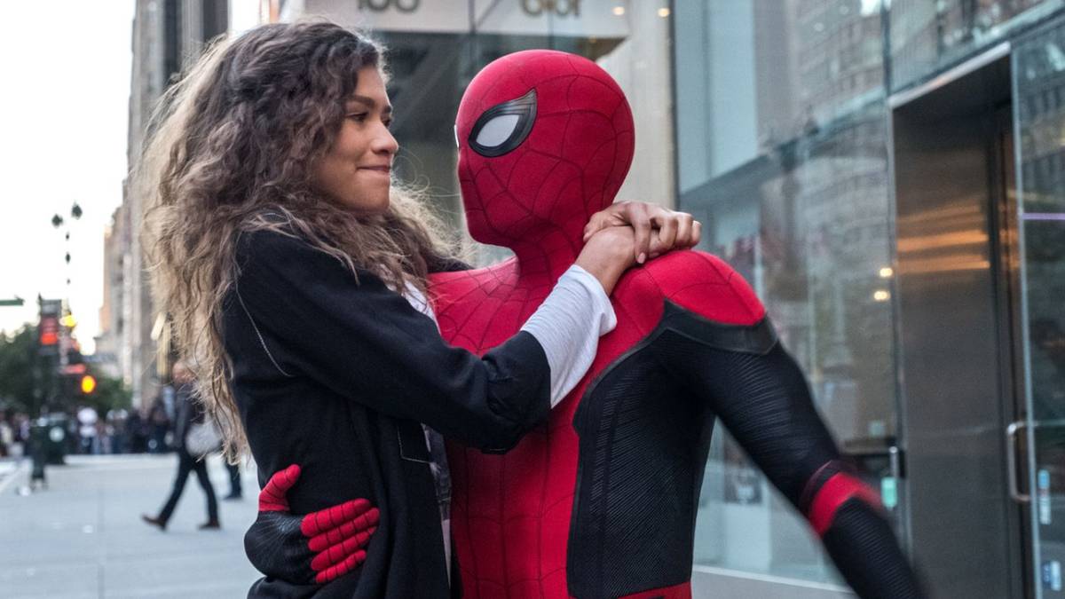 MJ holding on to Spider-Man as they land on an NYC sidewalk in Spider-Man: Far From Home