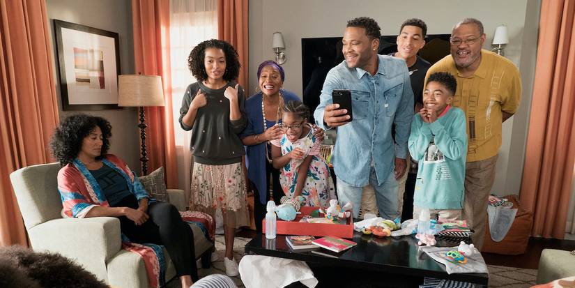 The Johnson family celebrating while matriarch Bow sits looking upset in Black-ish.