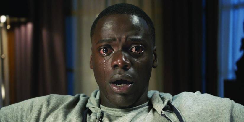 Daniel Kaluuya as Chris, looking terrified with a tear rolling down his cheek in Get Out