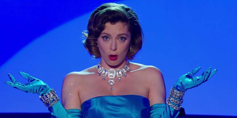 Rachel Bloom in a blue evening dress with matching gloves and vintage jewelry in Crazy Ex-Girlfriend.