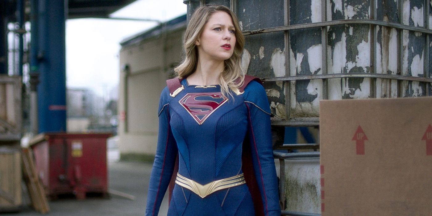 Melissa Benoist as Supergirl standing by a shipping container in Supergirl.