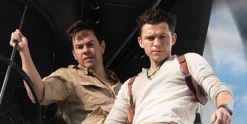 Mark Wahlberg and Tom Holland looking down from a plane in Uncharted