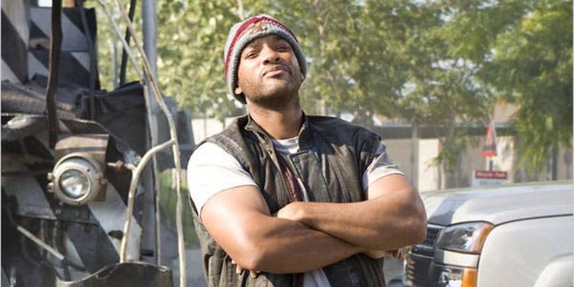 Will Smith as John Hancock confidently crossing his arms in Hancock