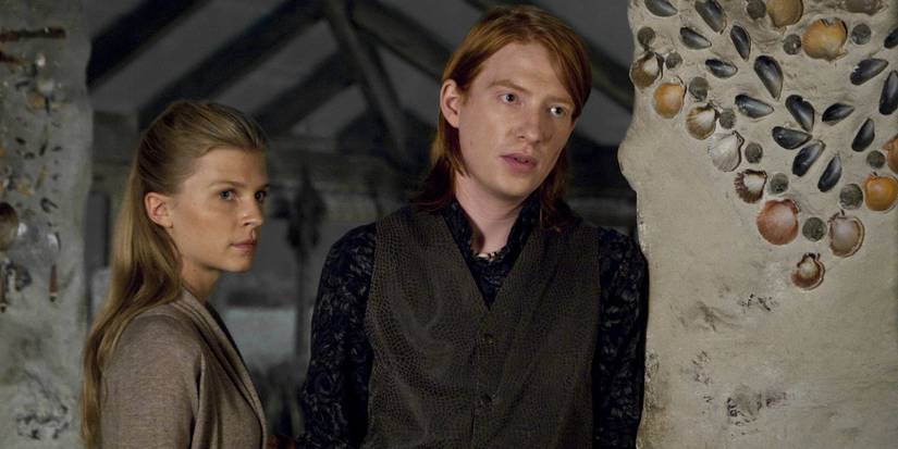 Clemence Poesy and Domhnall Gleeson looking to the side in Harry Potter and the Deathly Hallows Part 2.
