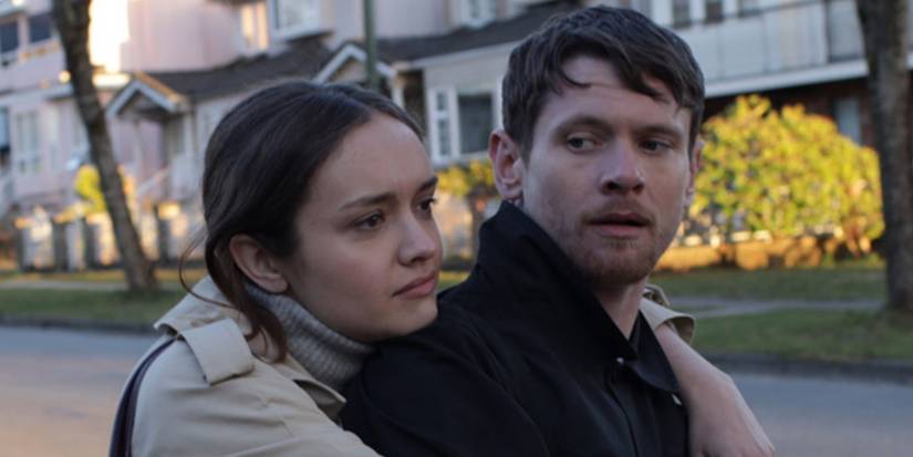 Olivia Cooke hugging Jack O'Connell from behind in Little Fish