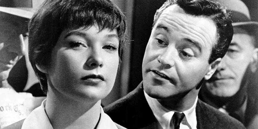 Bud leaning over Fran's (Shirley MacLaine and Jack Lemmon) shoulder in The Apartment.