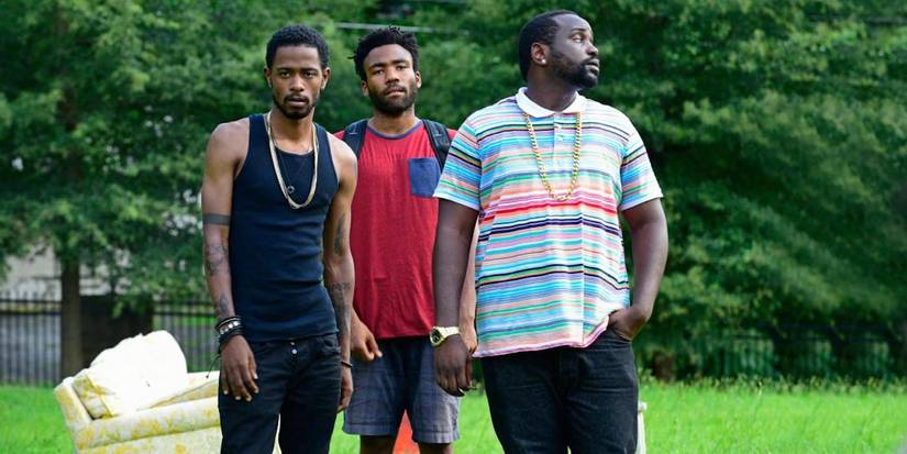 Darius, Alfred and Earn walking outside in Atlanta. 