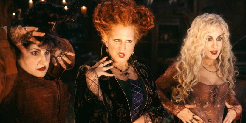 The Sanderson sisters look at something off camera and strike poses in Hocus Pocus