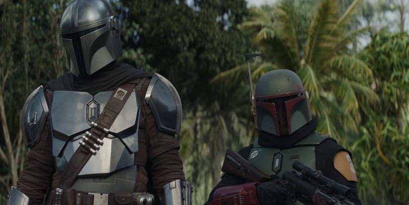 Boba Fett stands by Din Djarin in The Mandalorian.