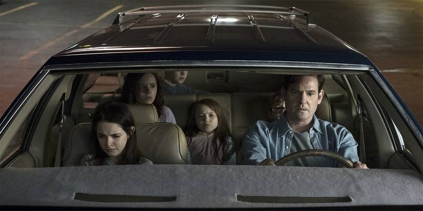 A man driving several distressed kids in The Haunting of Hill House.