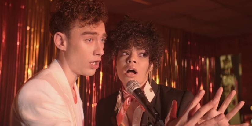 Olly Alexander and Lydia West singing in It's A Sin miniseries.