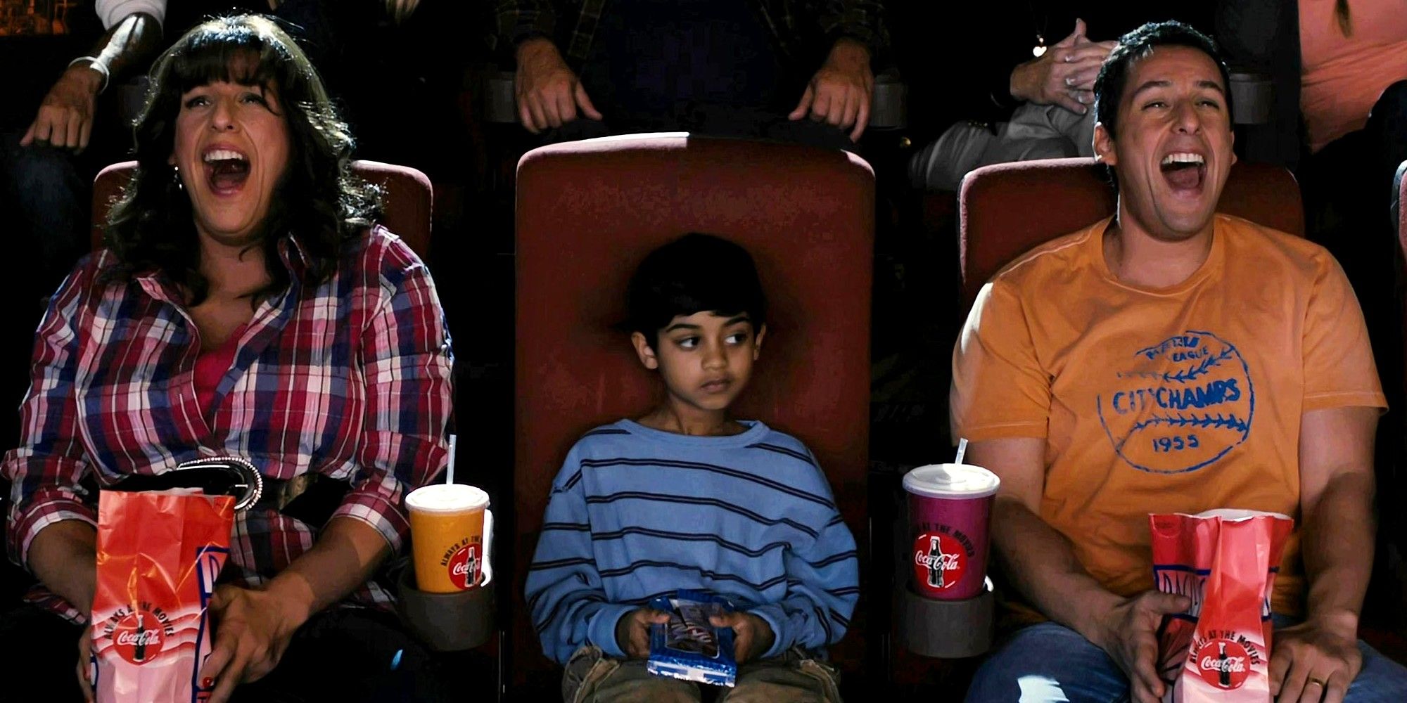 Adam Sandler as Jack and Jill laughing at the movies.