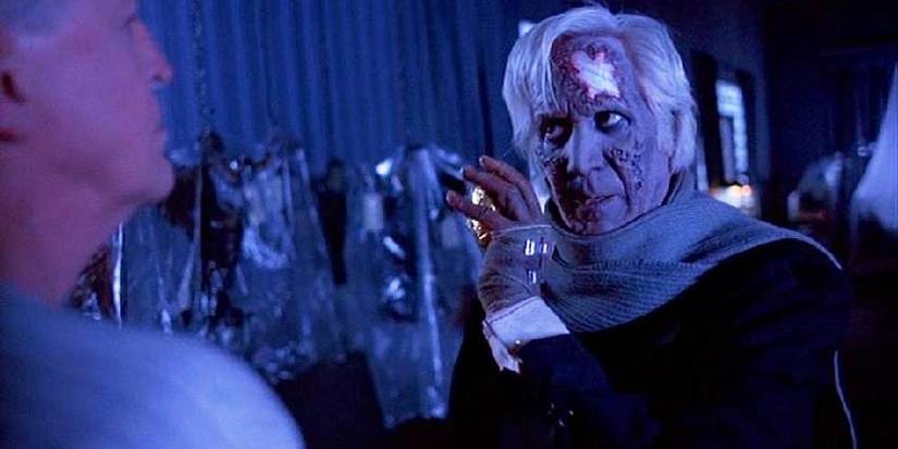 Jesus looking at someone and raising his left hand in Cronos.